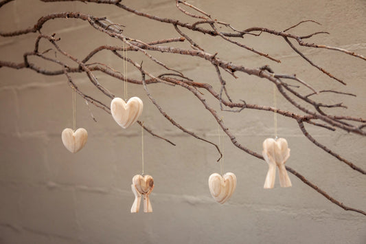 Hands Holding Heart Ornaments